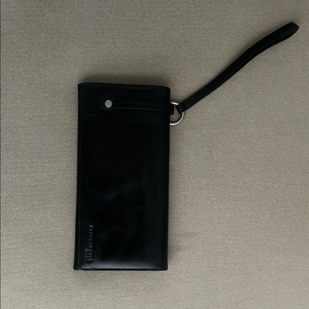 Kenneth Cole Black wallet with wristband.